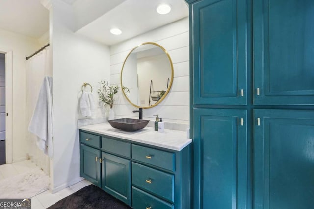 bathroom featuring tile patterned floors, vanity, and a shower with shower curtain