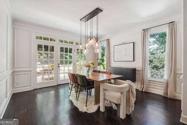 dining space with radiator, french doors, an inviting chandelier, dark hardwood / wood-style flooring, and ornamental molding