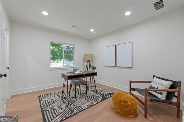 office with light wood finished floors, baseboards, visible vents, and recessed lighting