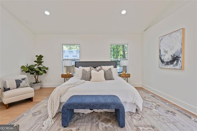 bedroom featuring recessed lighting, wood finished floors, and baseboards