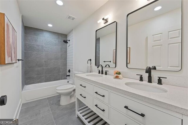 kitchen featuring white cabinetry, appliances with stainless steel finishes, and wall chimney range hood