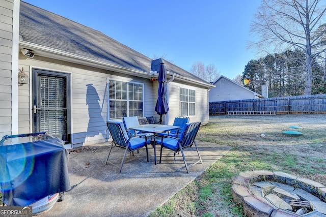 view of patio / terrace with area for grilling and an outdoor fire pit