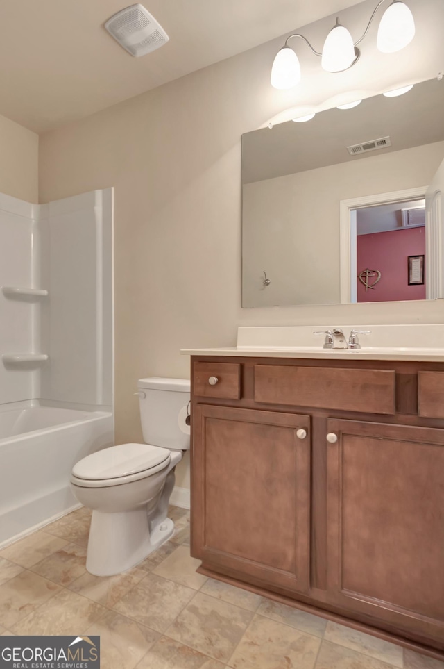 full bathroom featuring shower / bathing tub combination, vanity, and toilet