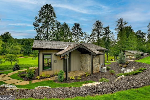 view of property exterior featuring a lawn