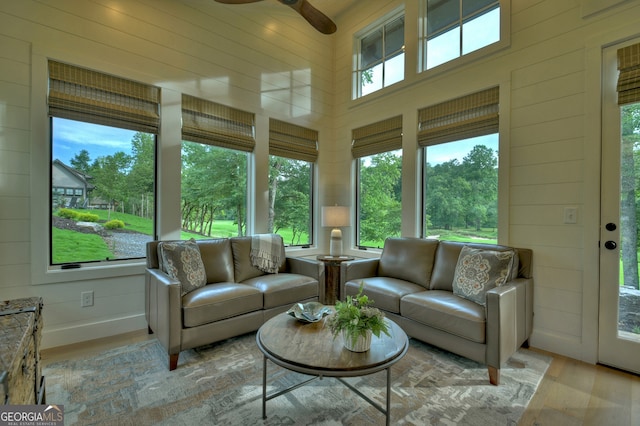 sunroom featuring ceiling fan