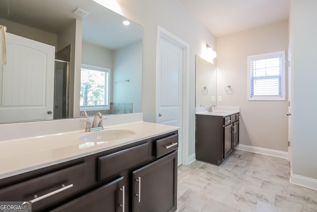 bathroom with vanity and a wealth of natural light