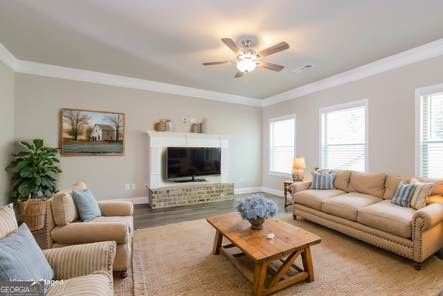 living room with hardwood / wood-style floors, ceiling fan, and ornamental molding