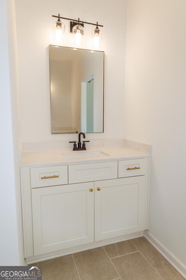 bathroom featuring tile patterned floors and vanity