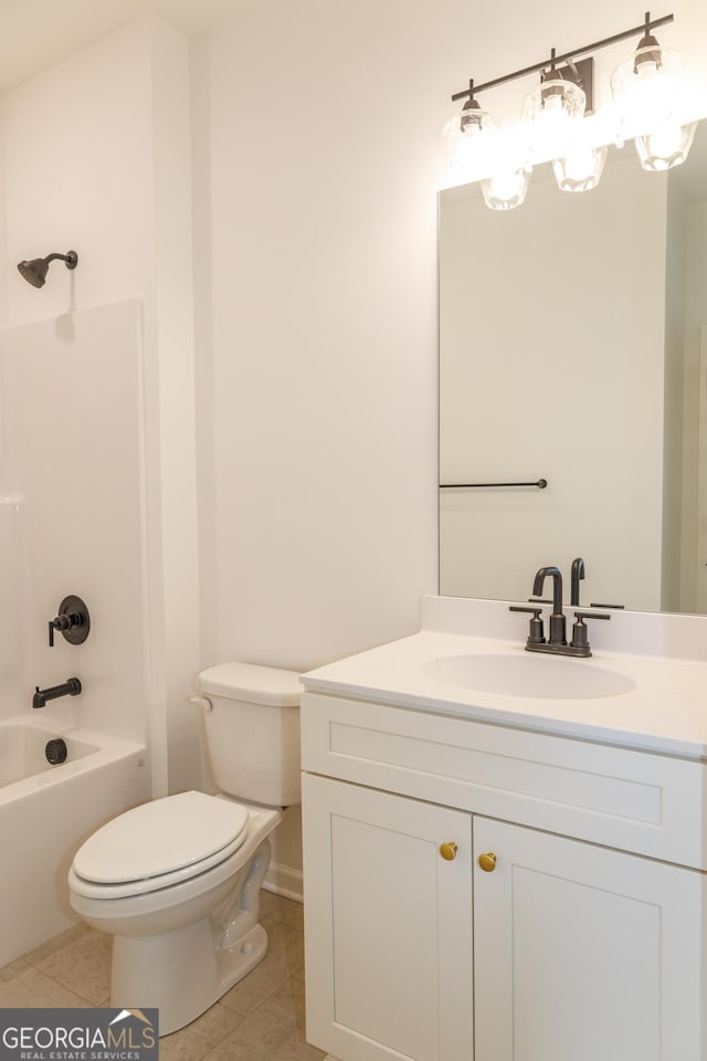 bathroom featuring toilet, tile patterned flooring, vanity, and shower / washtub combination