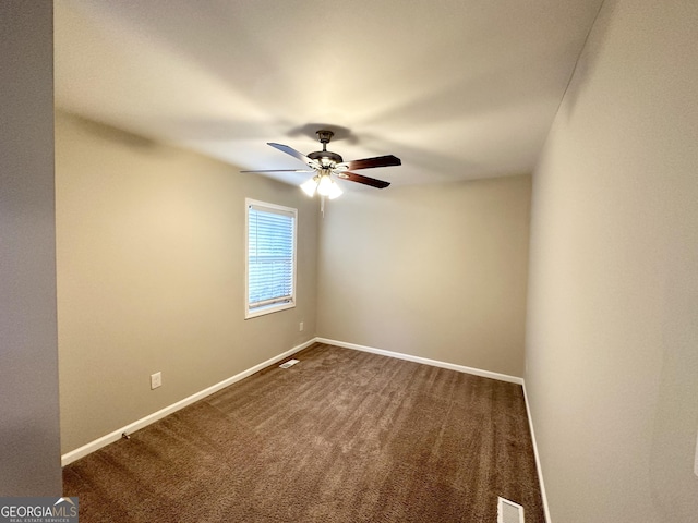 carpeted empty room with ceiling fan