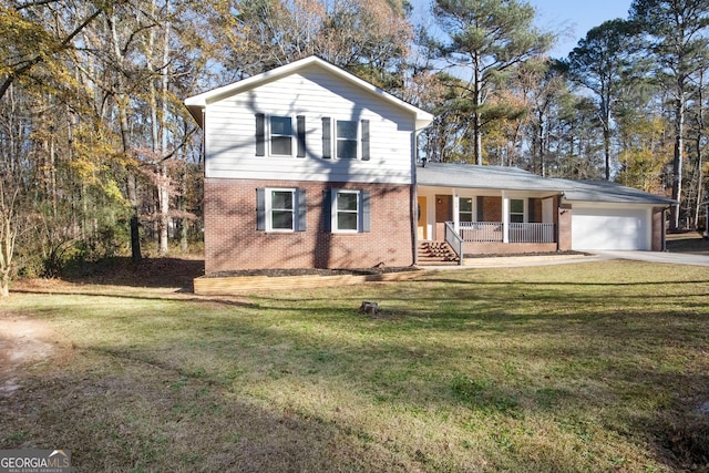 front of property featuring covered porch, a garage, and a front lawn