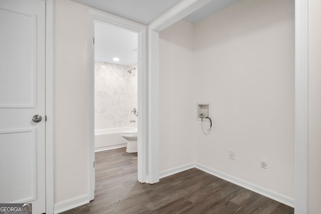 washroom featuring hookup for an electric dryer, hookup for a washing machine, and dark hardwood / wood-style flooring