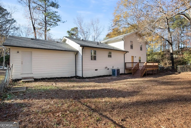 back of house with central AC unit and a wooden deck