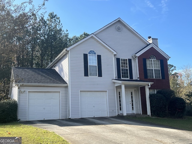 front of property with a garage