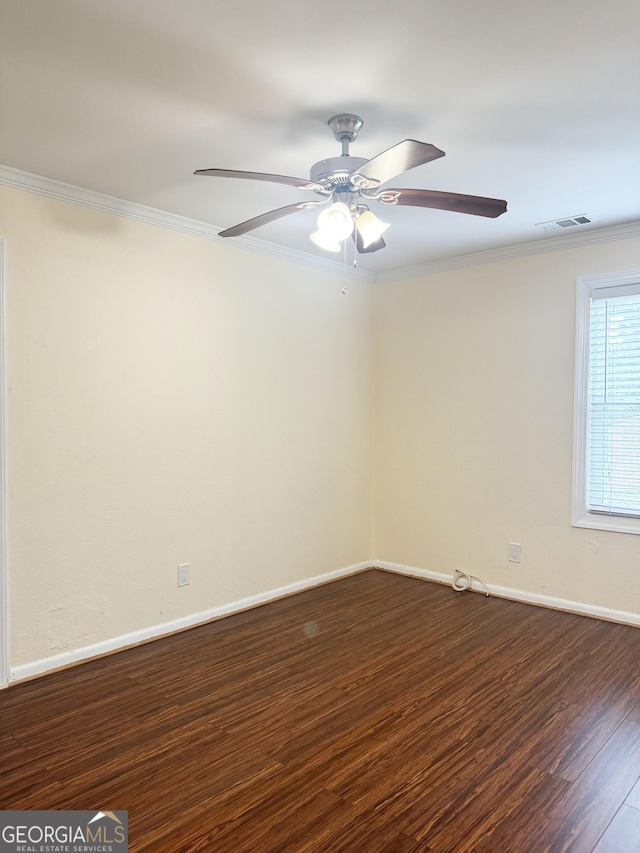 unfurnished room featuring dark hardwood / wood-style floors, ceiling fan, and ornamental molding