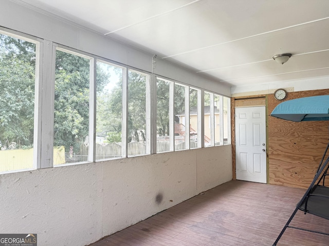 unfurnished sunroom with a wealth of natural light