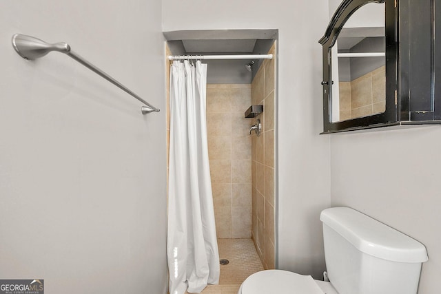 bathroom with toilet and curtained shower