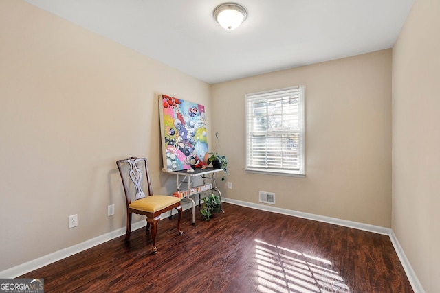 living area with dark hardwood / wood-style flooring