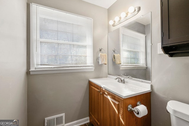 bathroom with vanity and toilet