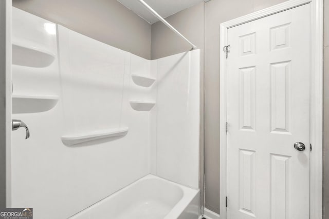 bathroom with shower / bath combination