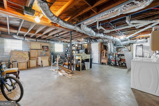 basement featuring washer and dryer and a healthy amount of sunlight