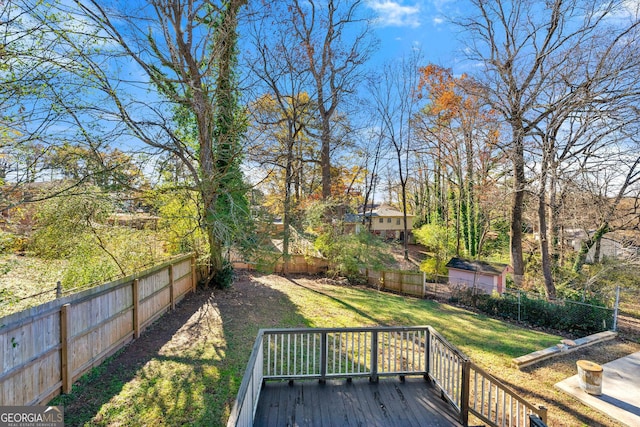 view of yard featuring a wooden deck