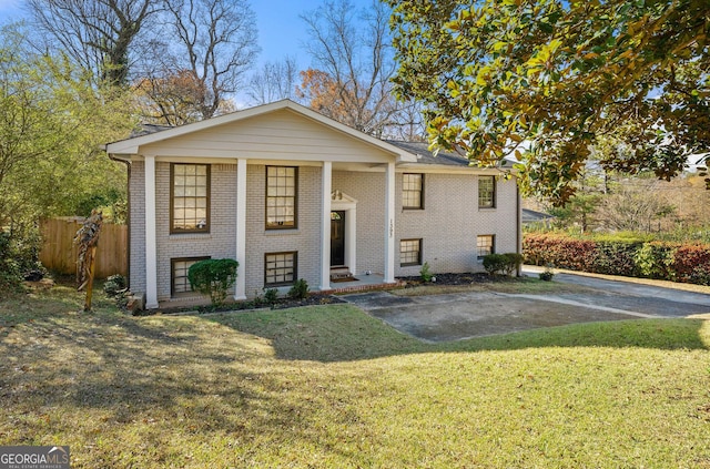 bi-level home with a front yard