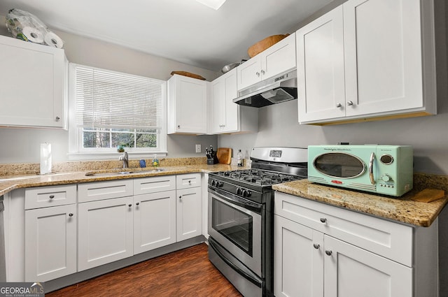 kitchen with white cabinets, gas stove, dark hardwood / wood-style floors, and sink