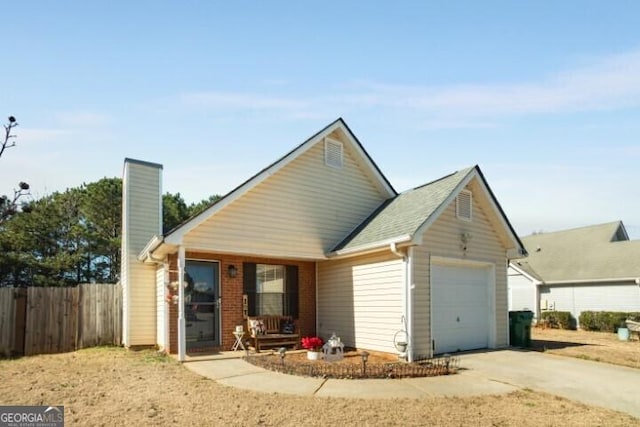 back of house featuring a garage