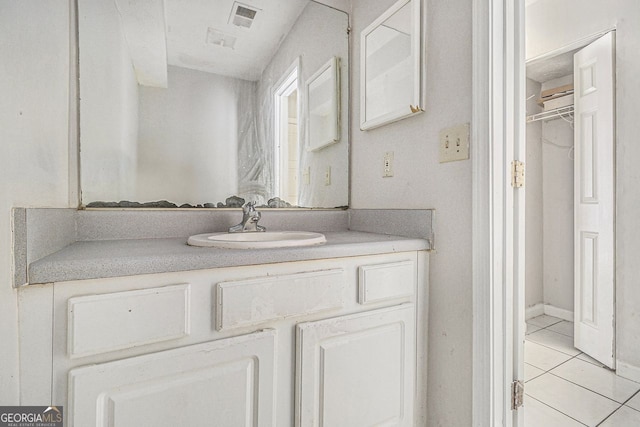 bathroom featuring tile patterned floors, visible vents, and vanity