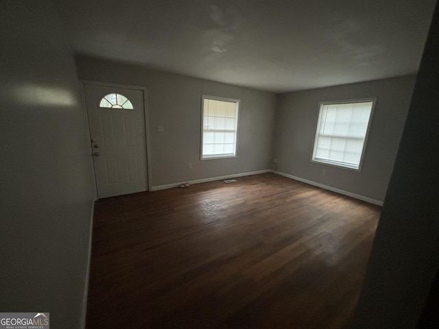 foyer featuring dark hardwood / wood-style floors