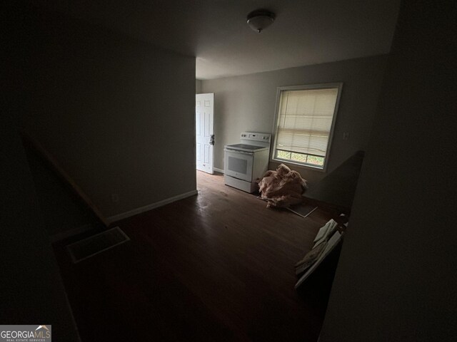 interior space with dark hardwood / wood-style flooring