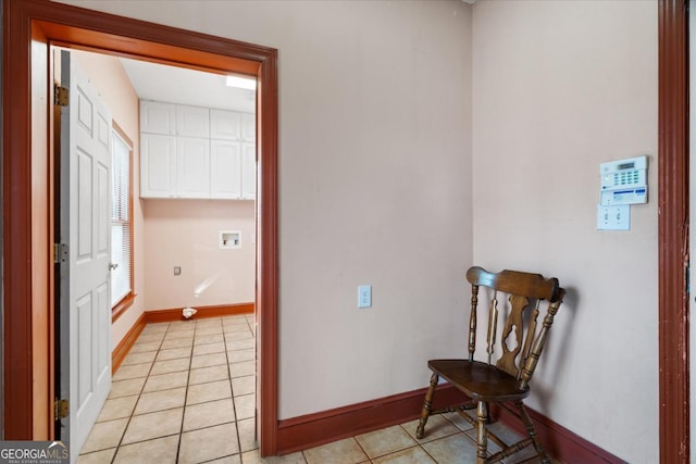 hall featuring light tile patterned flooring