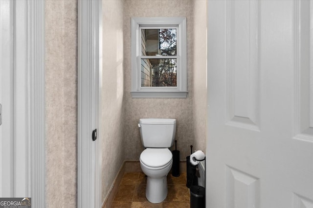 bathroom with tile patterned floors and toilet