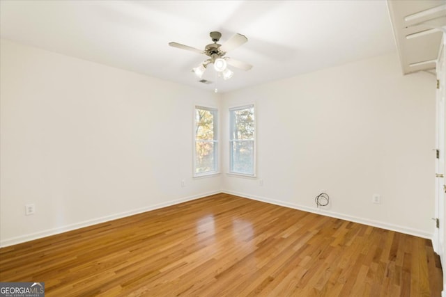 spare room with ceiling fan and light hardwood / wood-style flooring