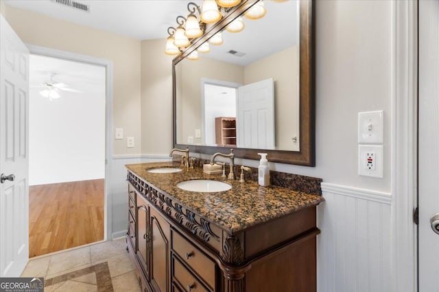 bathroom featuring ceiling fan, tile patterned flooring, and vanity