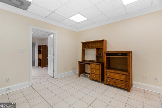 tiled empty room with a drop ceiling