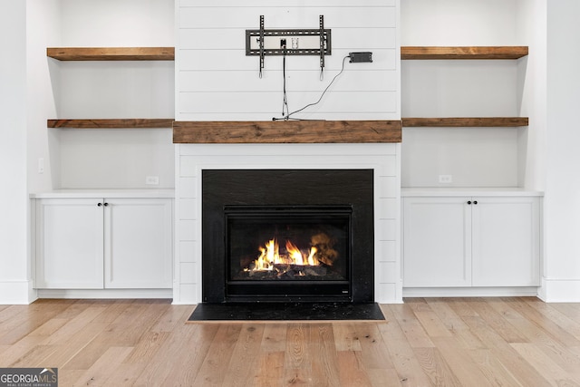 interior details with hardwood / wood-style flooring