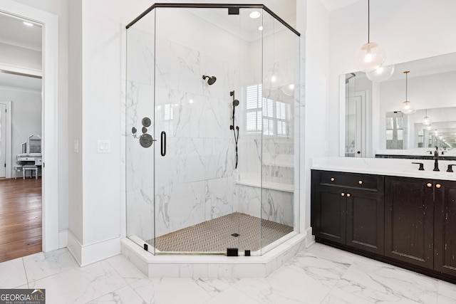 bathroom with vanity and a shower with door