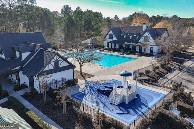 view of swimming pool with a patio