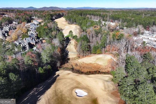 birds eye view of property with a mountain view