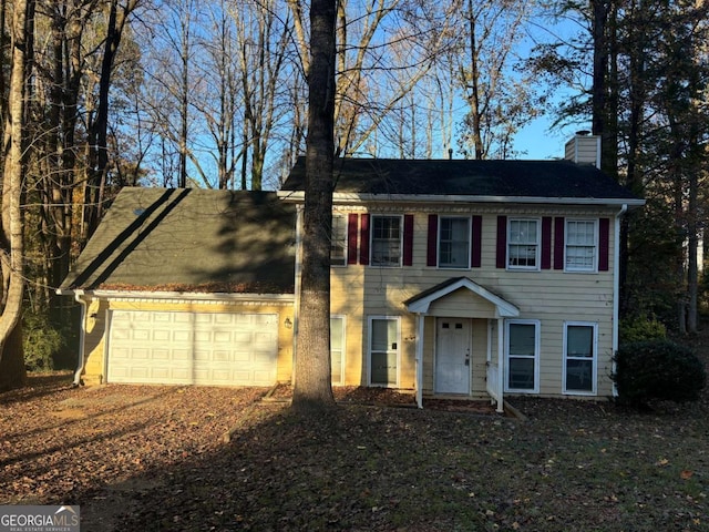 colonial home with a garage