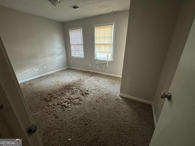 empty room featuring carpet flooring