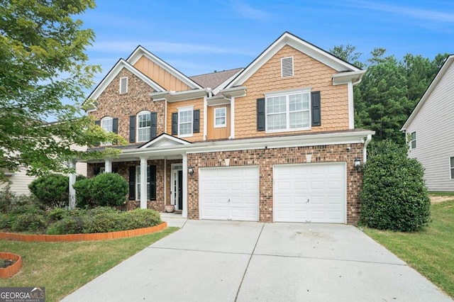 view of front of home featuring a front lawn and a garage