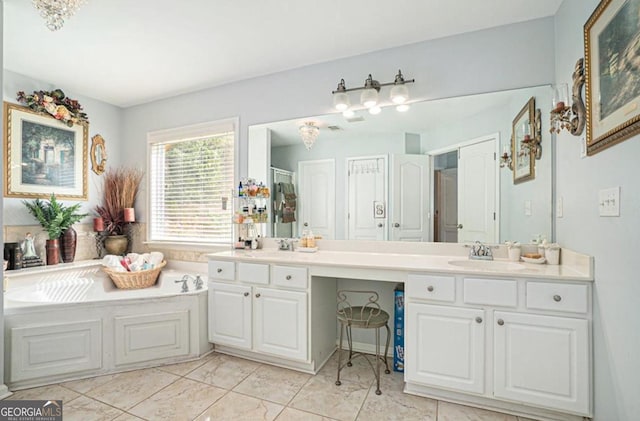 bathroom with tile patterned floors, vanity, and a bathtub