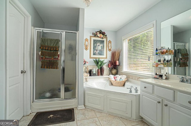 bathroom with tile patterned floors, vanity, and independent shower and bath