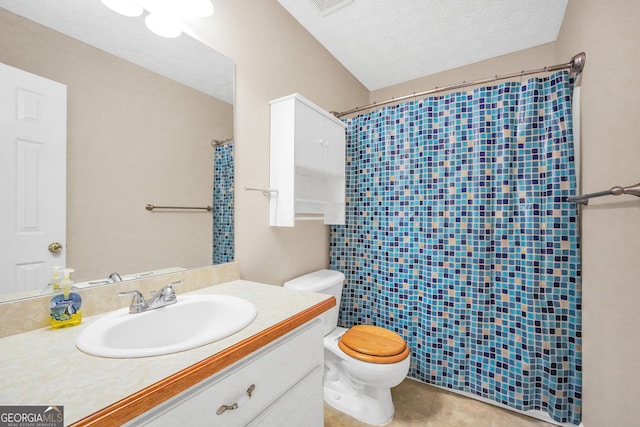 bathroom with vanity, a textured ceiling, tile patterned flooring, toilet, and curtained shower