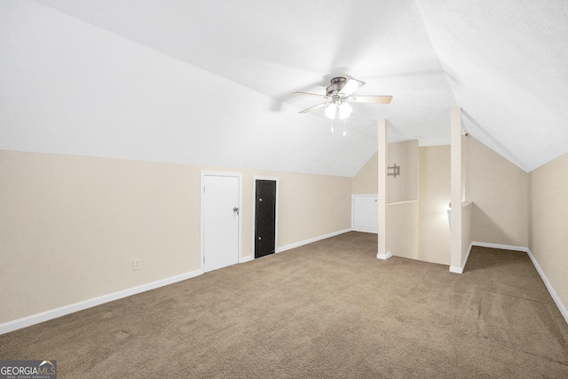 bonus room with carpet flooring, vaulted ceiling, and ceiling fan