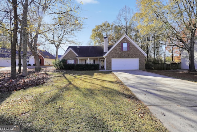 view of front of house with a garage and a front lawn