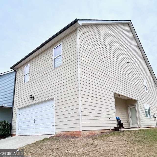 view of home's exterior with a garage